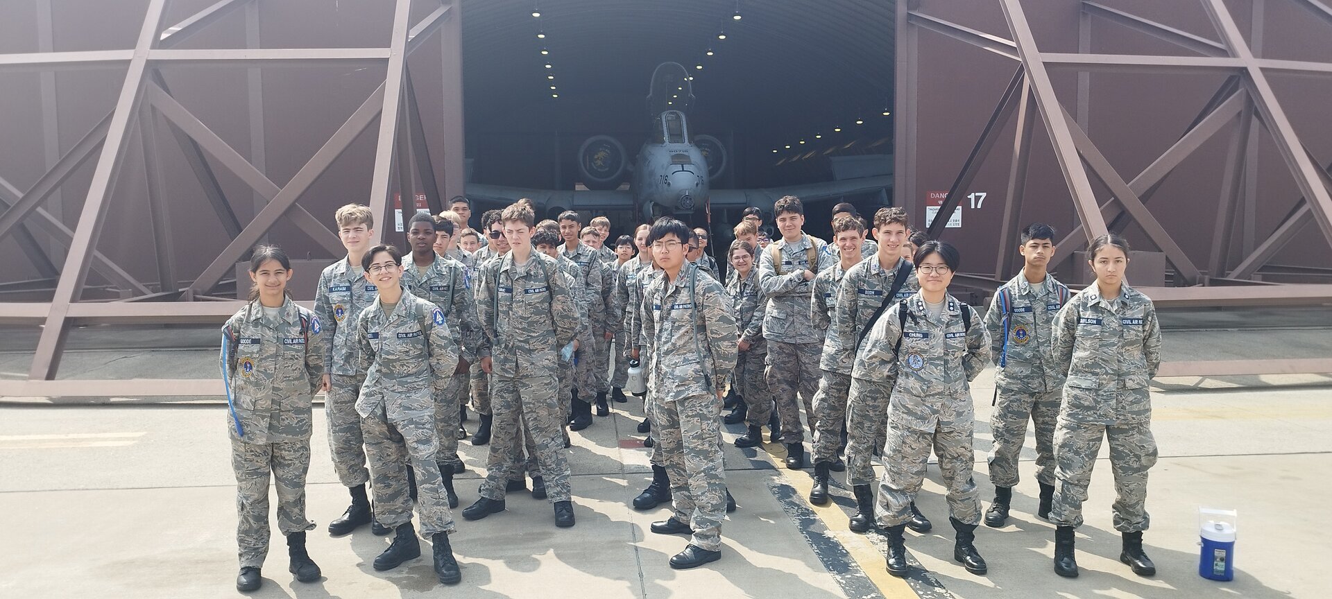 CAP squadron group photo at hangar entrance